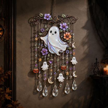 Halloween ghost wind chime suncatcher hanging on wall with candle glow
