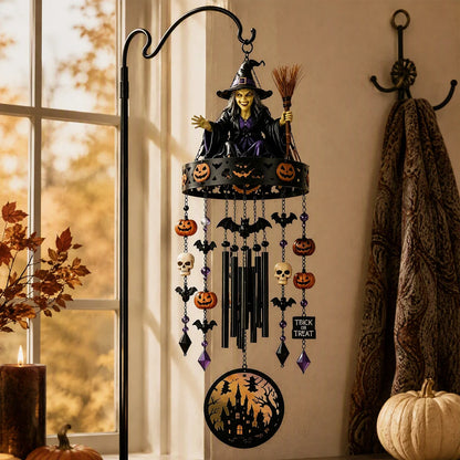 Halloween wind chime hung from a garden branch