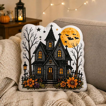 Styled on a sofa: haunted house moon plush pillow with haunted house, bats and full moon artwork
