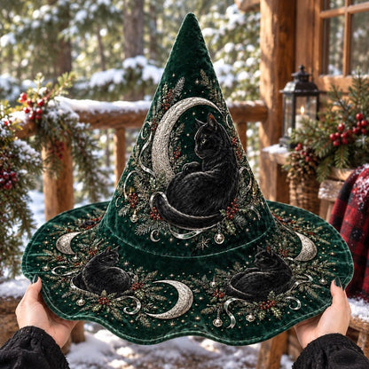 Hearth Cat Witch Hat held by witch hands outdoors in natural sunlight