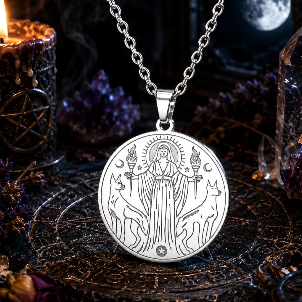 Hecate Triple Goddess Necklace – Witchcraft Occult Pendant with a candle and crystals in the background