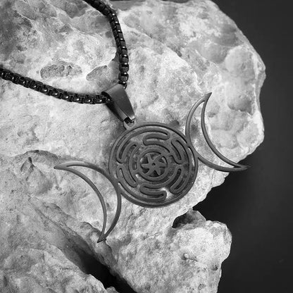 Striking black stainless steel Hecate Wheel Triple Moon necklace, a powerful Wicca jewelry piece.