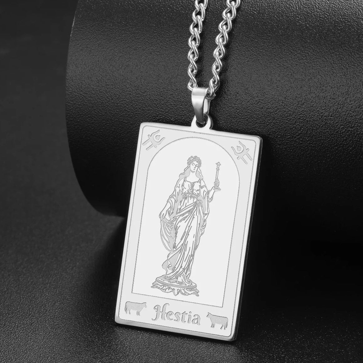 Greek goddess pendant shown at an angle to reveal its relief