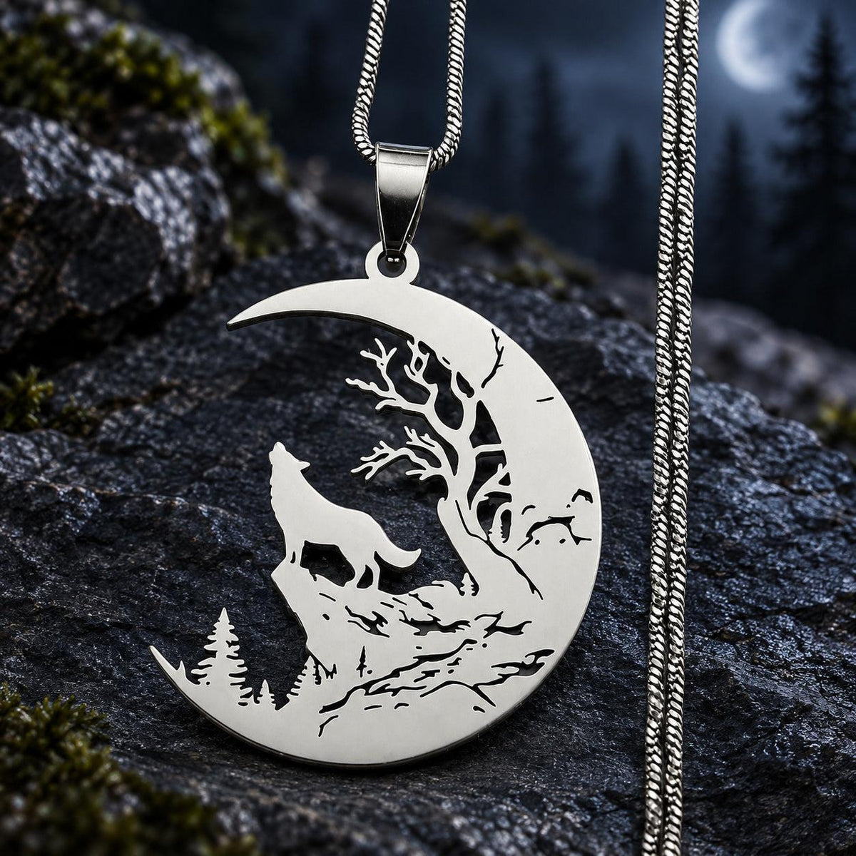 Silver stainless steel Howling Wolf Crescent Moon Necklace with detailed tree and wolf cutouts on dark stone.