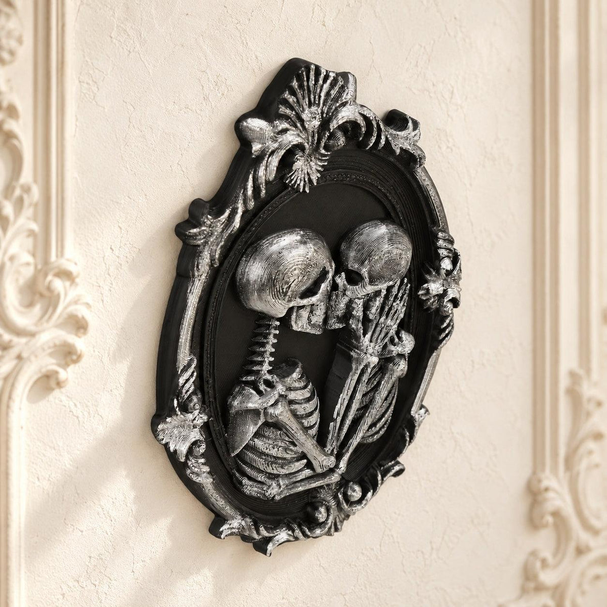 Kissing Skeleton Couple Wall Decor Oval Baroque Frame — view 4 showing carved details in a bright gothic vintage setting