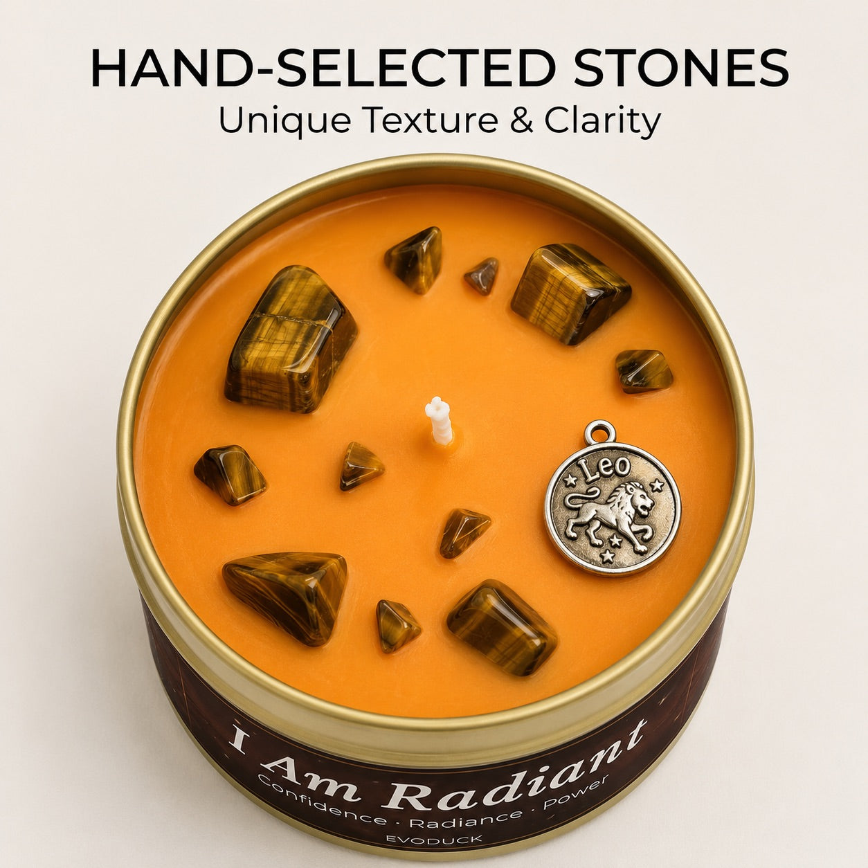 Close-up of Leo Candle orange wax with tiger eye crystal chunks and a Leo lion charm - Hand-Selected Stones, Unique Texture and Clarity
