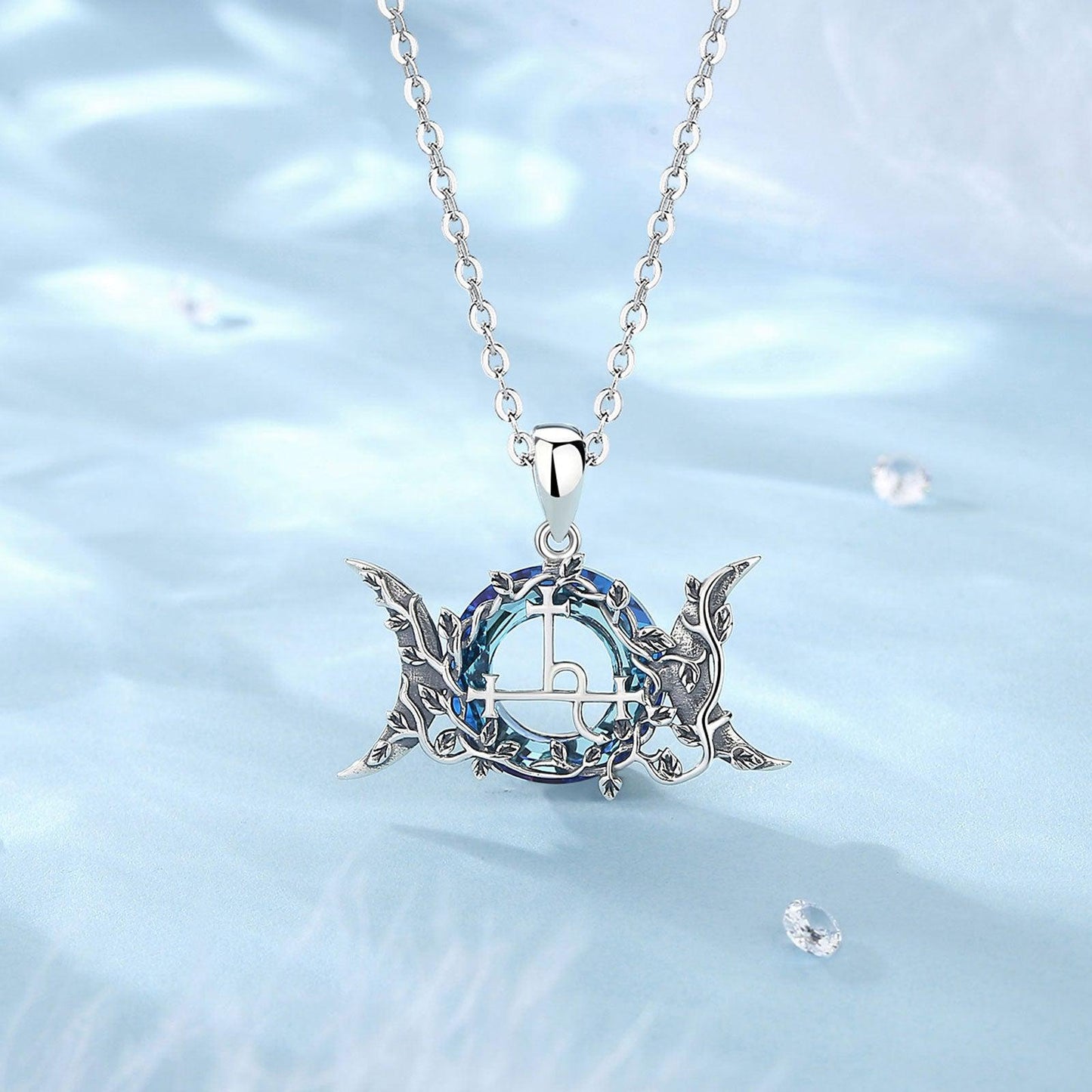 925 Sterling Silver Lilith Moon Necklace with blue crystal and intricate Wicca Pagan design.
