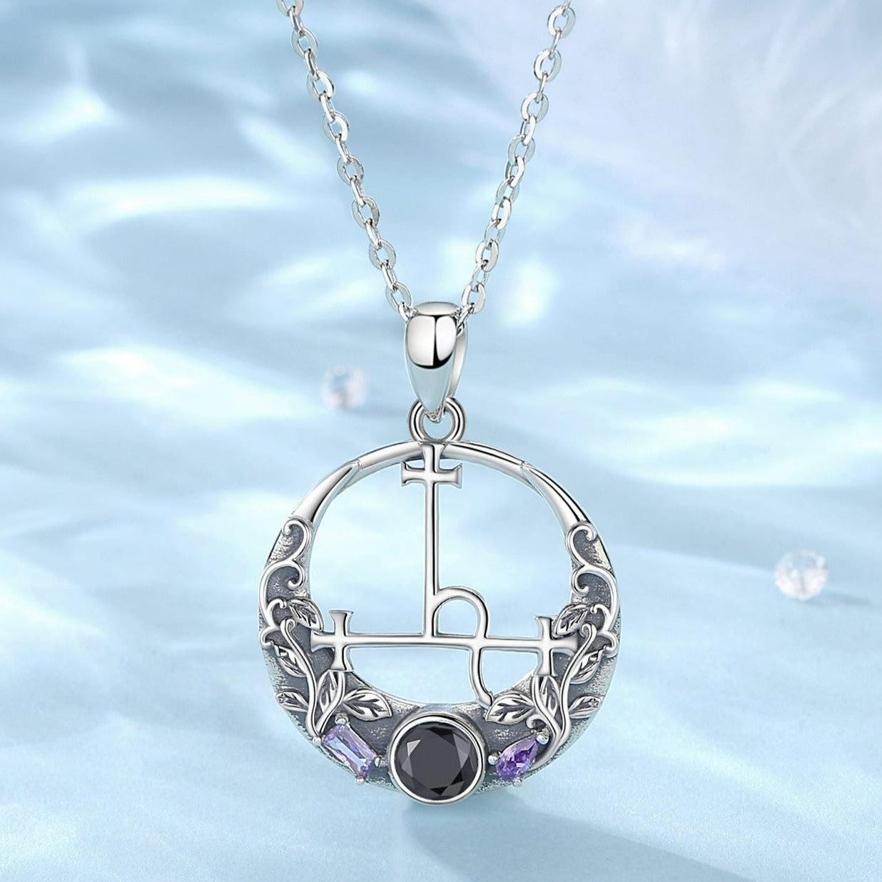 Sterling silver Lilith Sigil Wiccan necklace with intricate leaves, a black gemstone, and purple accents.