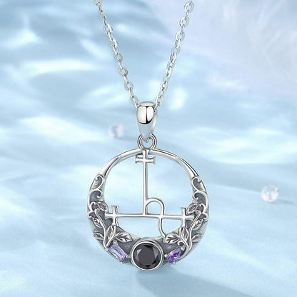 Sterling silver Lilith Sigil Wiccan necklace with intricate leaves, a black gemstone, and purple accents.