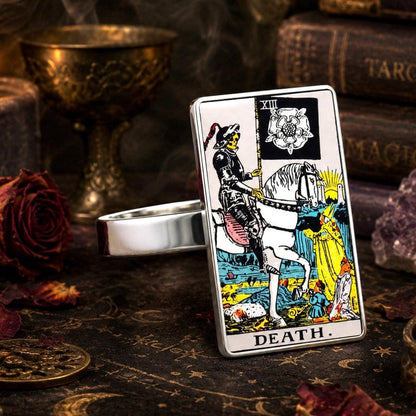 Death tarot card ring in stainless steel with dried roses, candlelight and an antique goblet