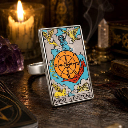 Wheel of Fortune tarot card ring in stainless steel with quartz points, amethyst and a lit candle