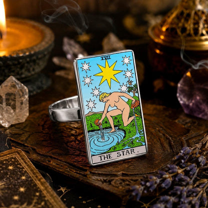 The Star tarot card ring in stainless steel on an old grimoire with quartz and incense smoke