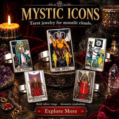 Bold silver tarot card rings displayed on a dark altar with Justice, The Emperor and The Tower artwork