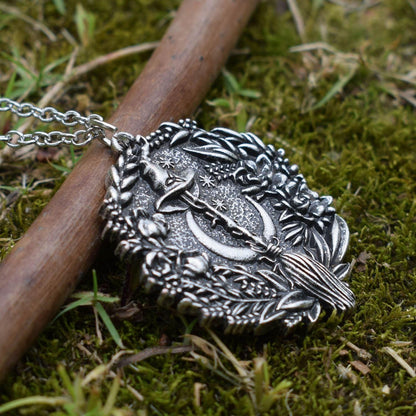 Captivating silver plated Moon Hat Broom Witch Halloween Necklace with intricate floral details.