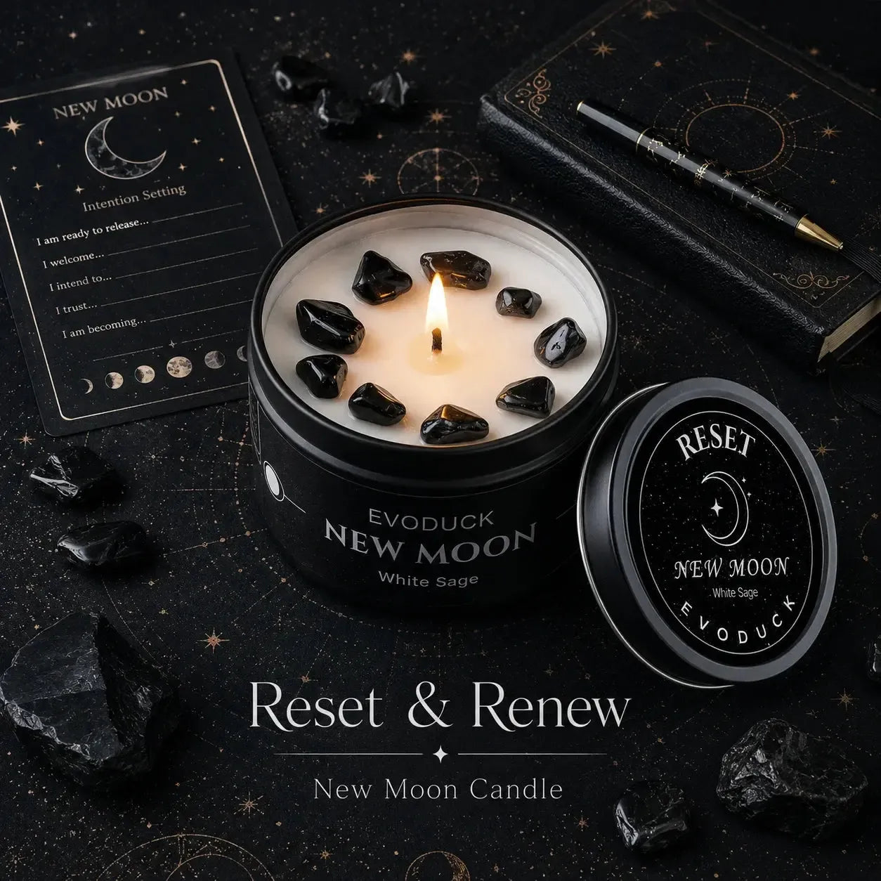 New Moon Candle Reset and Renew with black obsidian crystals in soy wax, intention-setting journal card, pen and moon phase icons on a starry dark background