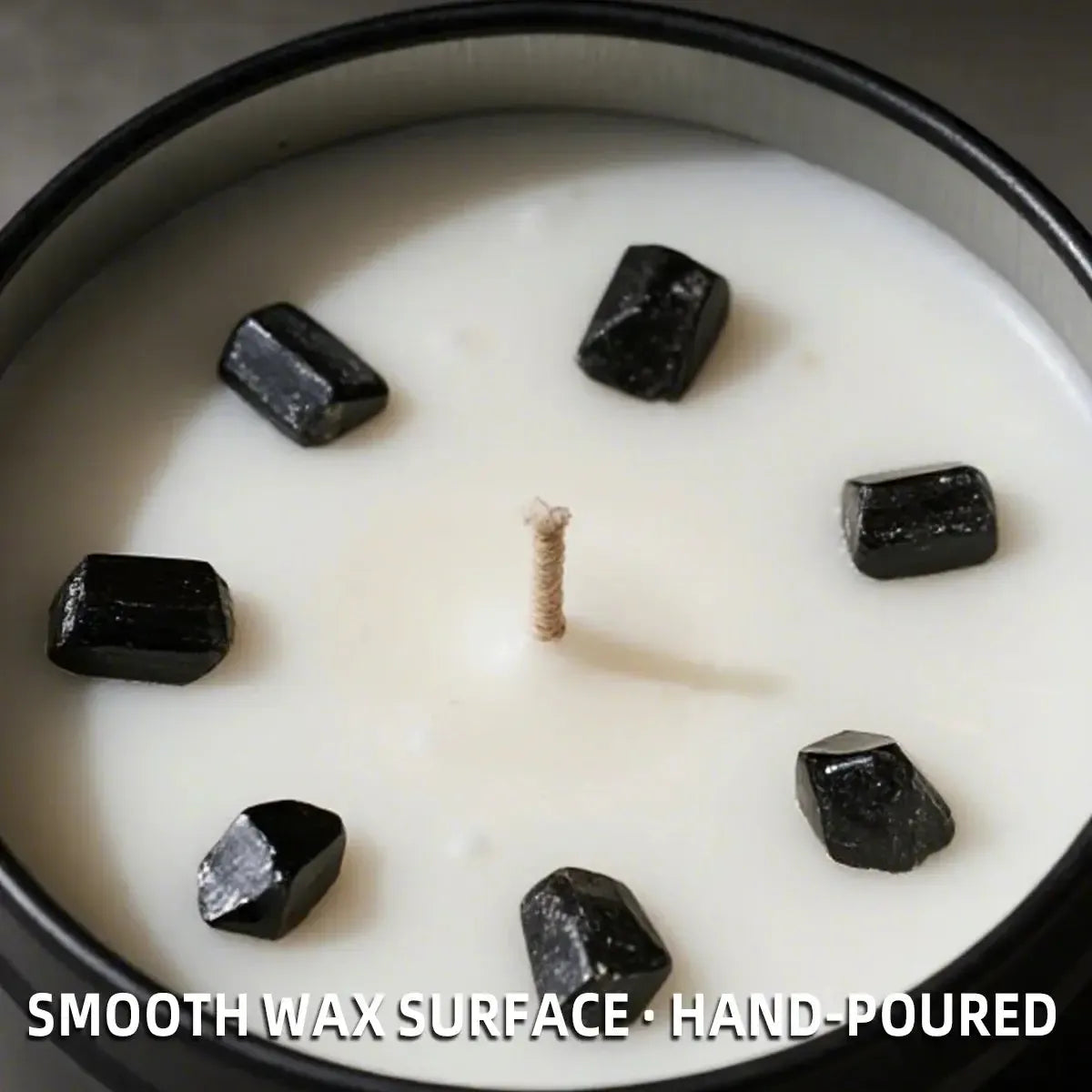Close-up of New Moon Candle with black obsidian crystal chunks in smooth soy wax and cotton wick - hand-poured