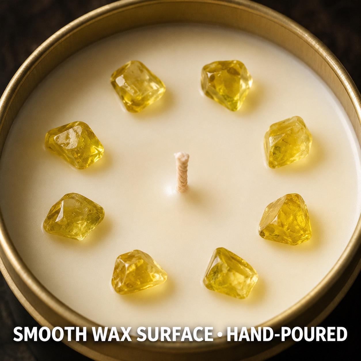 Close-up of First Quarter Candle with citrine crystal chunks in smooth soy wax and gold tin rim - hand-poured
