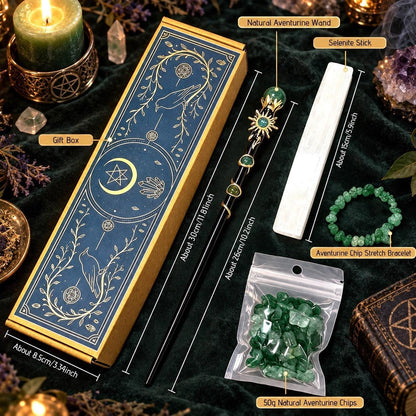 A styled flat-lay of a wiccan altar set with labeled callouts showing a blue and gold gift box, a natural aurore wand, a selenium stick, an aurore charm bracelet, and 50g of natural aurore chips, all arranged on a dark green velvet cloth with candles and crystals.