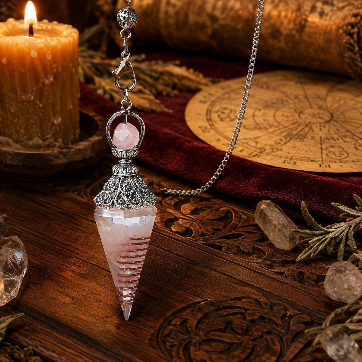 Rose quartz spirit pendulum on a warm Wiccan ritual altar