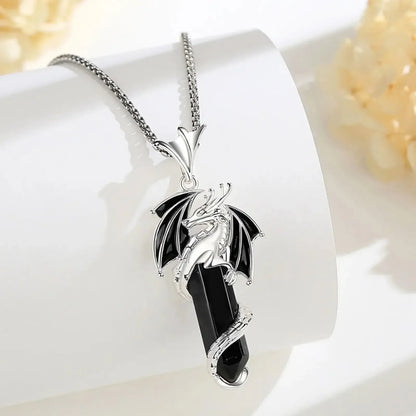 Sculpted dragon detail wrapped around the obsidian pendant