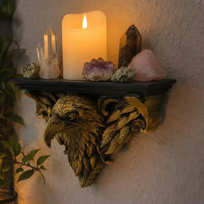 Styled shelf with decorative objects: Ornate Eagle Head Wall Shelf, featuring a sculpted eagle head with surrounding feathers and scrolling supports.