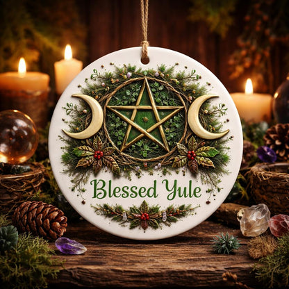 White ceramic Pagan Yule ornament with green pentacle, golden triple moon, holly, and "Blessed Yule" text.