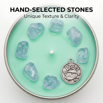 Close-up of Pisces Candle teal wax with aquamarine crystal chunks and a Pisces fish charm - Hand-Selected Stones, Unique Texture and Clarity