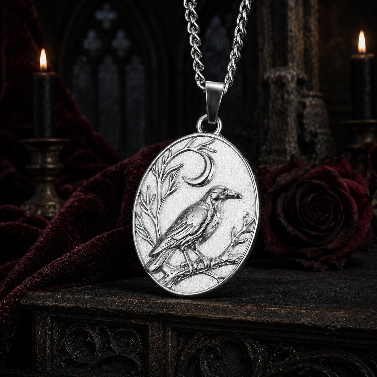 Silver Raven Crescent Moon necklace close-up with detailed crow engraving