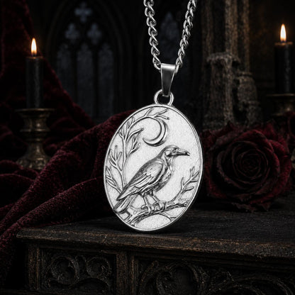 Silver Raven Crescent Moon necklace close-up with detailed crow engraving