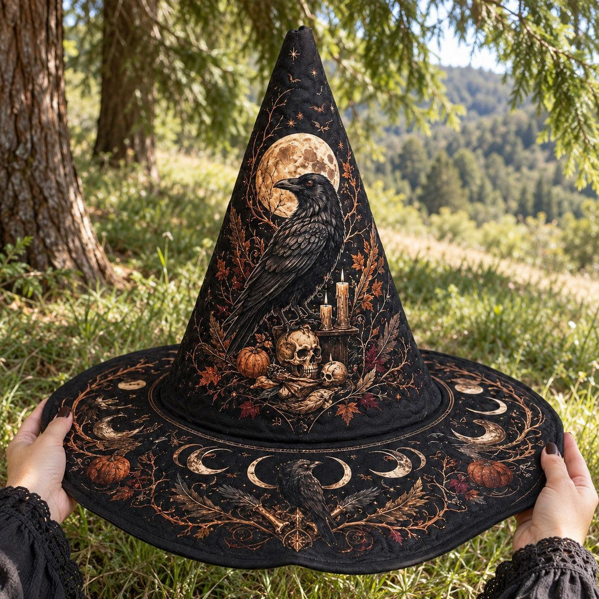 Raven Skull Witch Hat held by witch hands outdoors in natural sunlight