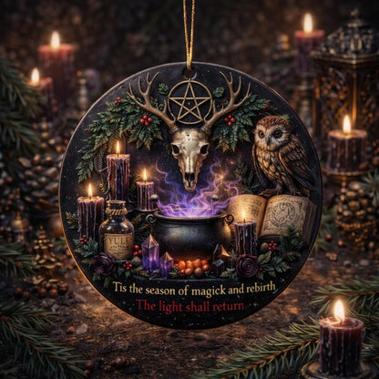 Dark ceramic Yule ornament with pentacle deer skull, owl, cauldron, candles, and "The light shall return" text.