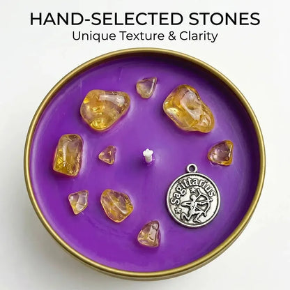Close-up of Sagittarius Candle purple wax with citrine crystal chunks and a Sagittarius archer charm - Hand-Selected Stones, Unique Texture and Clarity