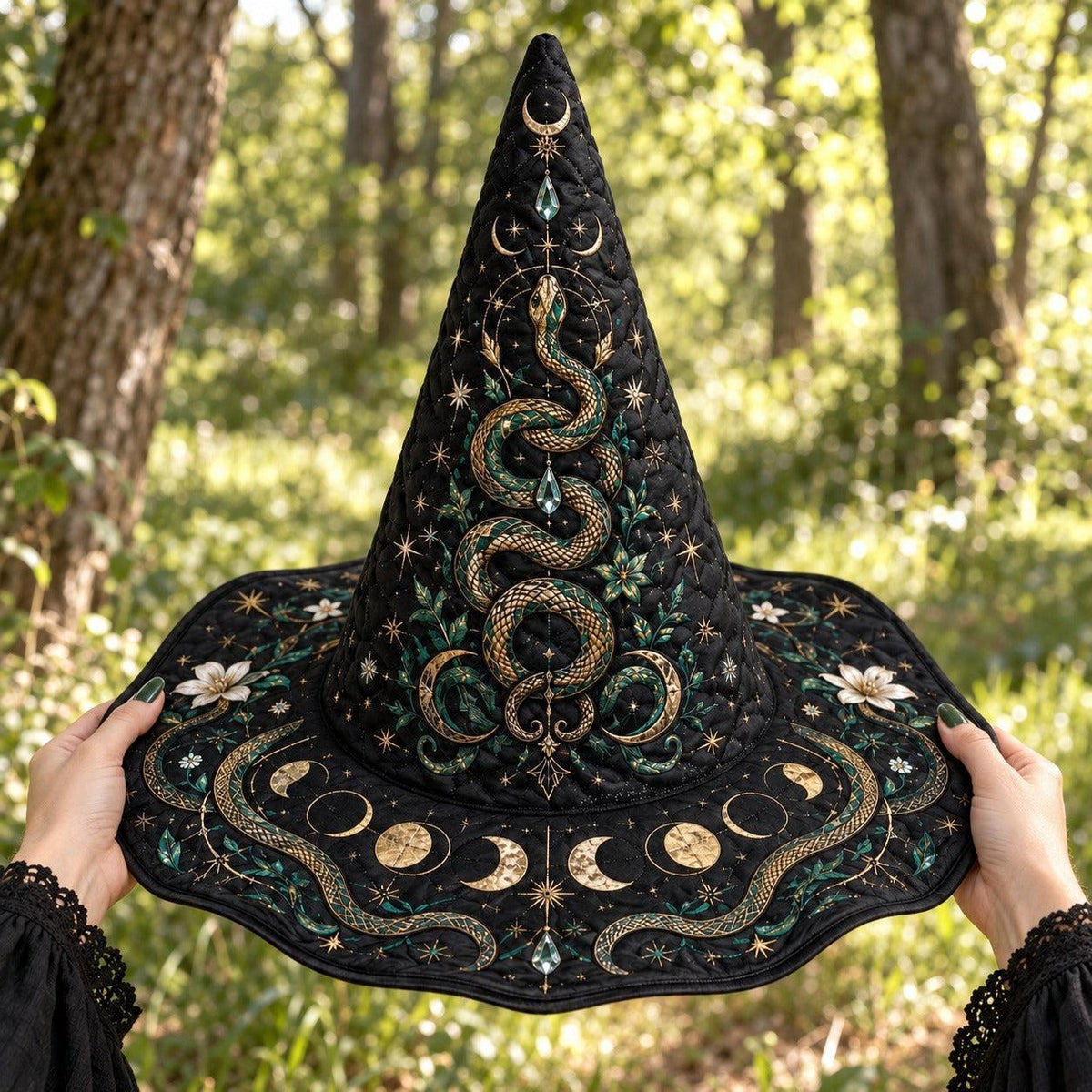 Serpent Moon Witch Hat held by witch hands outdoors in natural sunlight