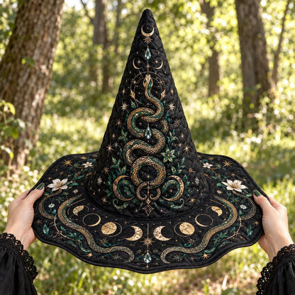 Serpent Moon Witch Hat held by witch hands outdoors in natural sunlight