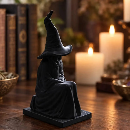 Angled witch statue on a table