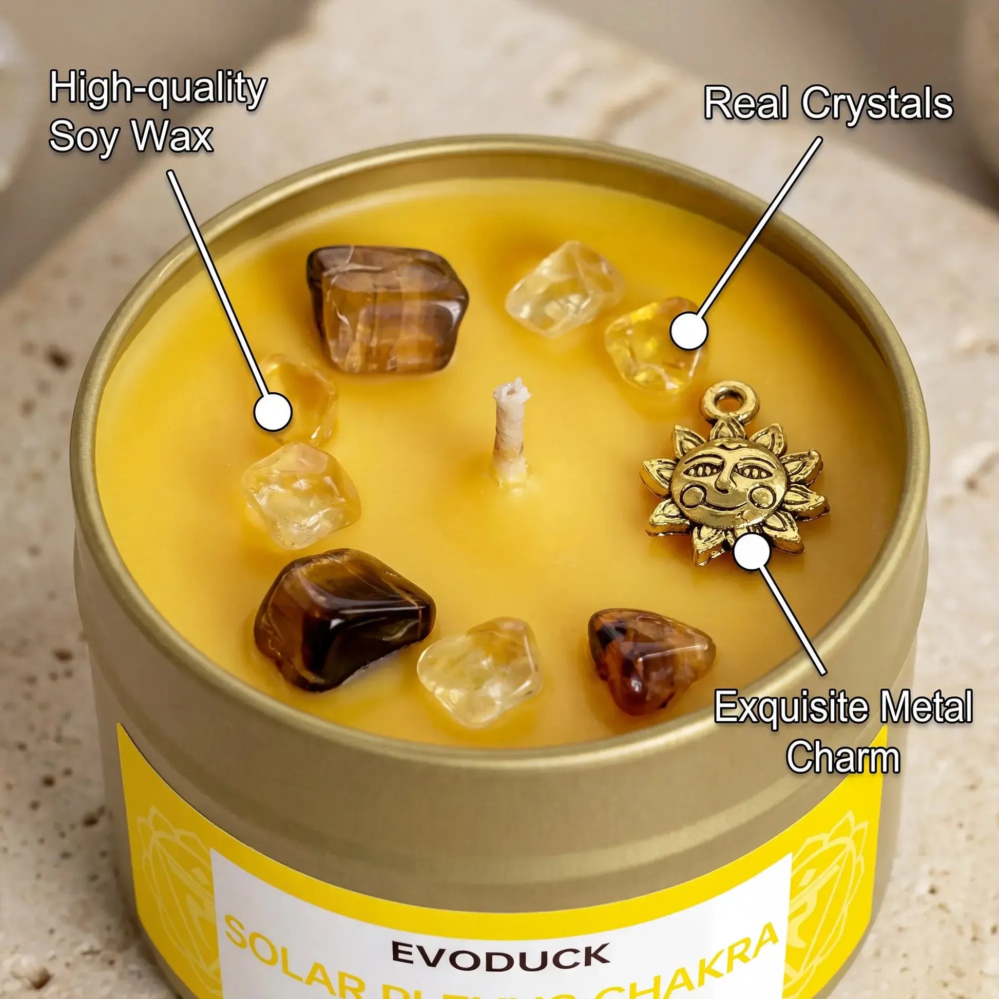 Solar plexus chakra candle with crystal and sun charm close-up