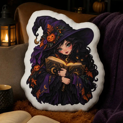 Styled room view: decorative plush pillow featuring witch with spellbook artwork