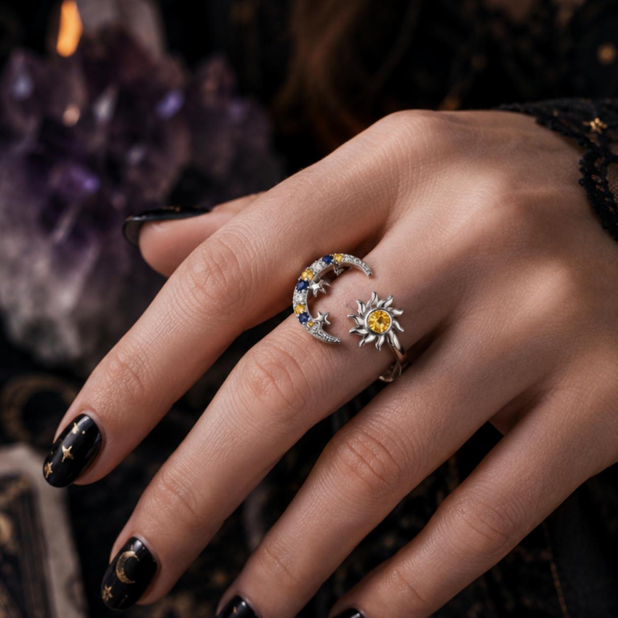 Hand wearing rings with a mystical background featuring candles and crystals.