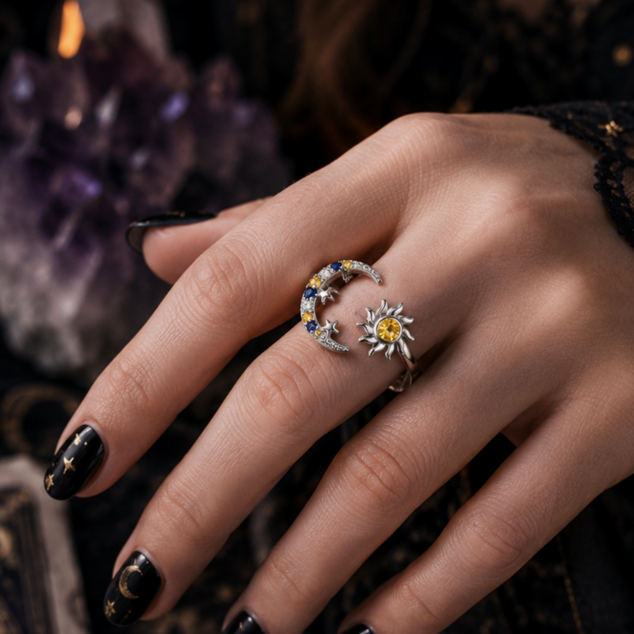 Hand wearing rings with a mystical background featuring candles and crystals.