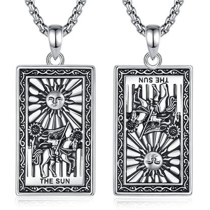 Silver "The Sun" Major Arcana Tarot card necklace, showing upright and reversed designs.