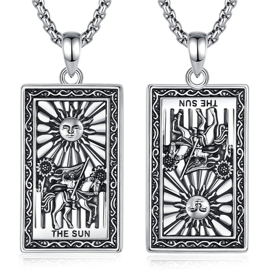 Silver "The Sun" Major Arcana Tarot card necklace, showing upright and reversed designs.