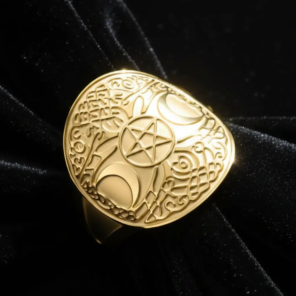 Gold triple moon pentacle ring, angled close-up with dramatic lighting on Celtic knotwork