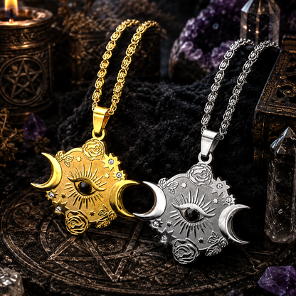Two celestial-themed pendants, one gold and one silver, on dark mystical background with crystals and candles.