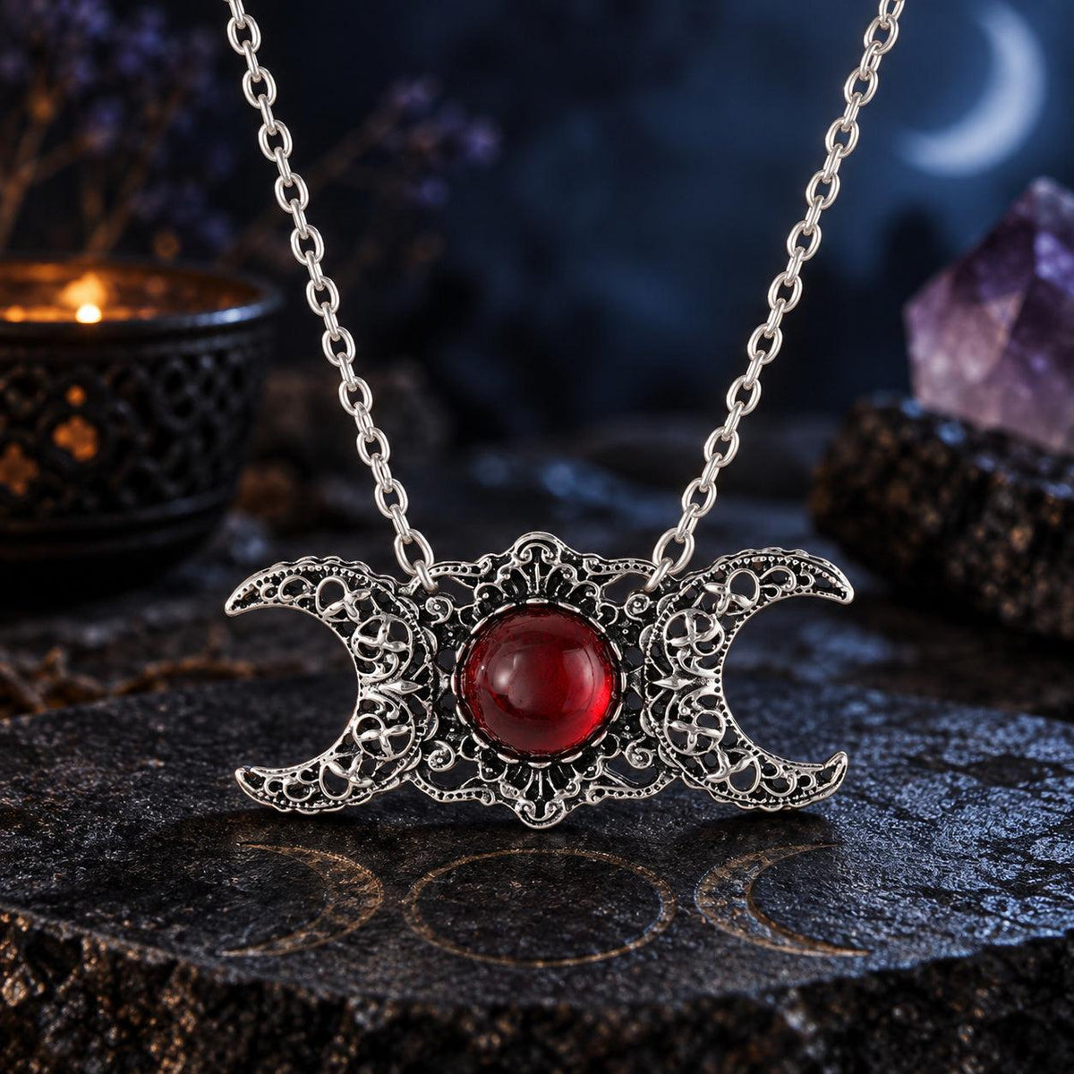 Triple Moon Goddess necklace with red center stone in dark Wiccan scene, view 6