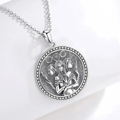 Sterling silver Triple Moon Goddess Hecate Amulet necklace with intricate Witch Knot and three goddess figures.