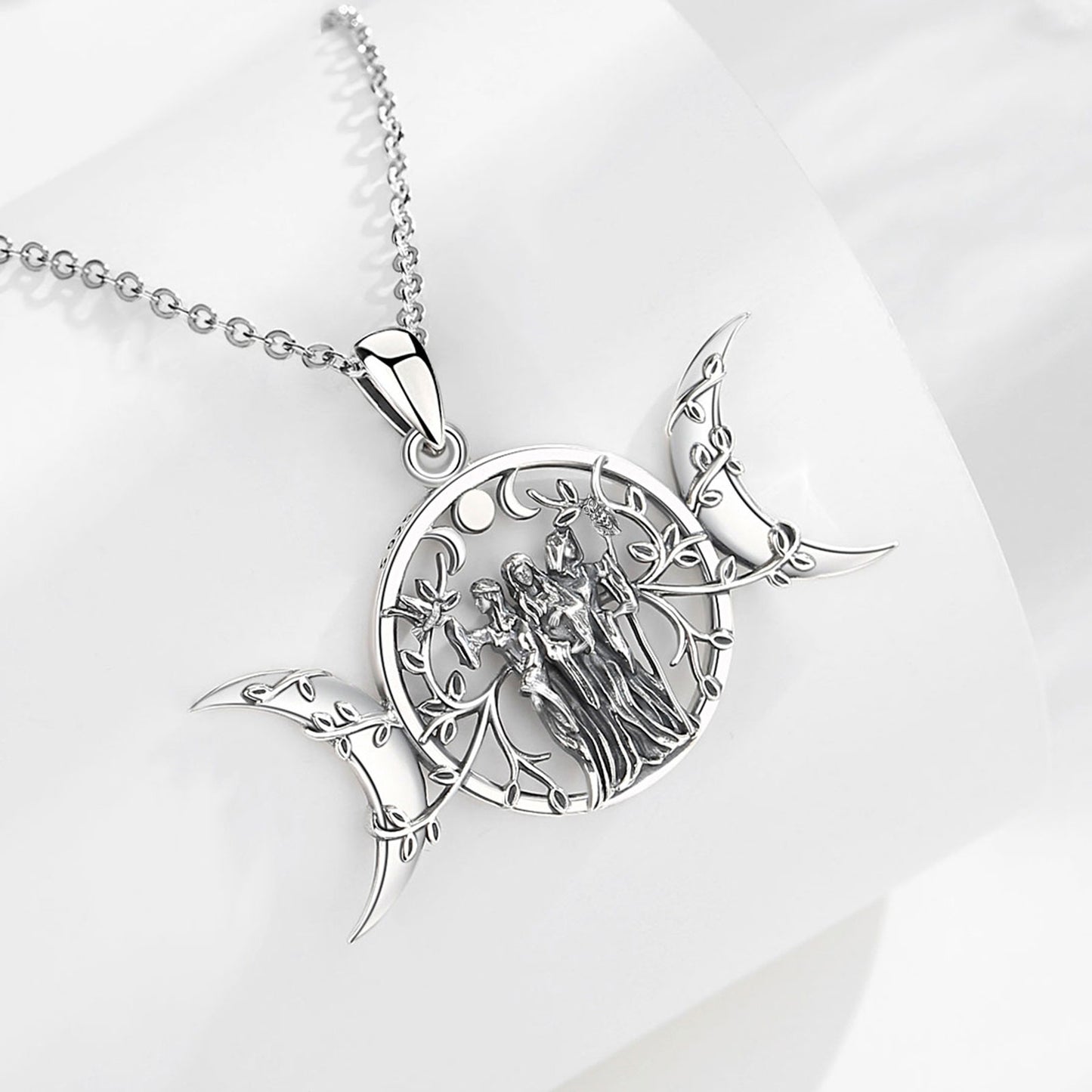 Sterling silver Triple Moon Goddess necklace with Hecate amulet, intricate tree and figures.