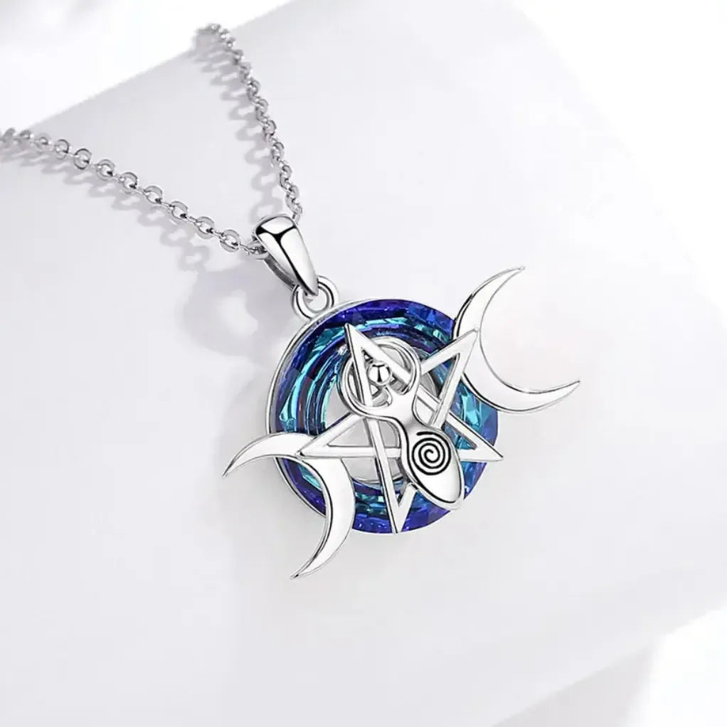 Triple Moon necklace on a pale display surface