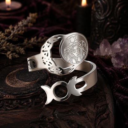 Silver Triple Moon Goddess adjustable ring detail on a dark Wicca altar