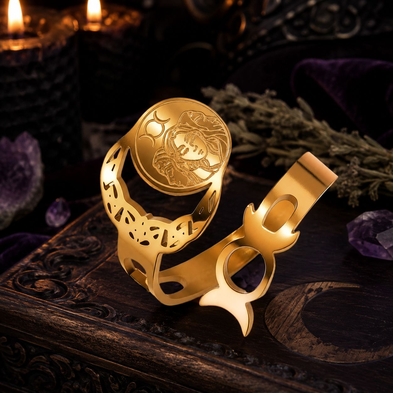 Gold Wiccan talisman ring angled view showing Goddess engraving and moon phases