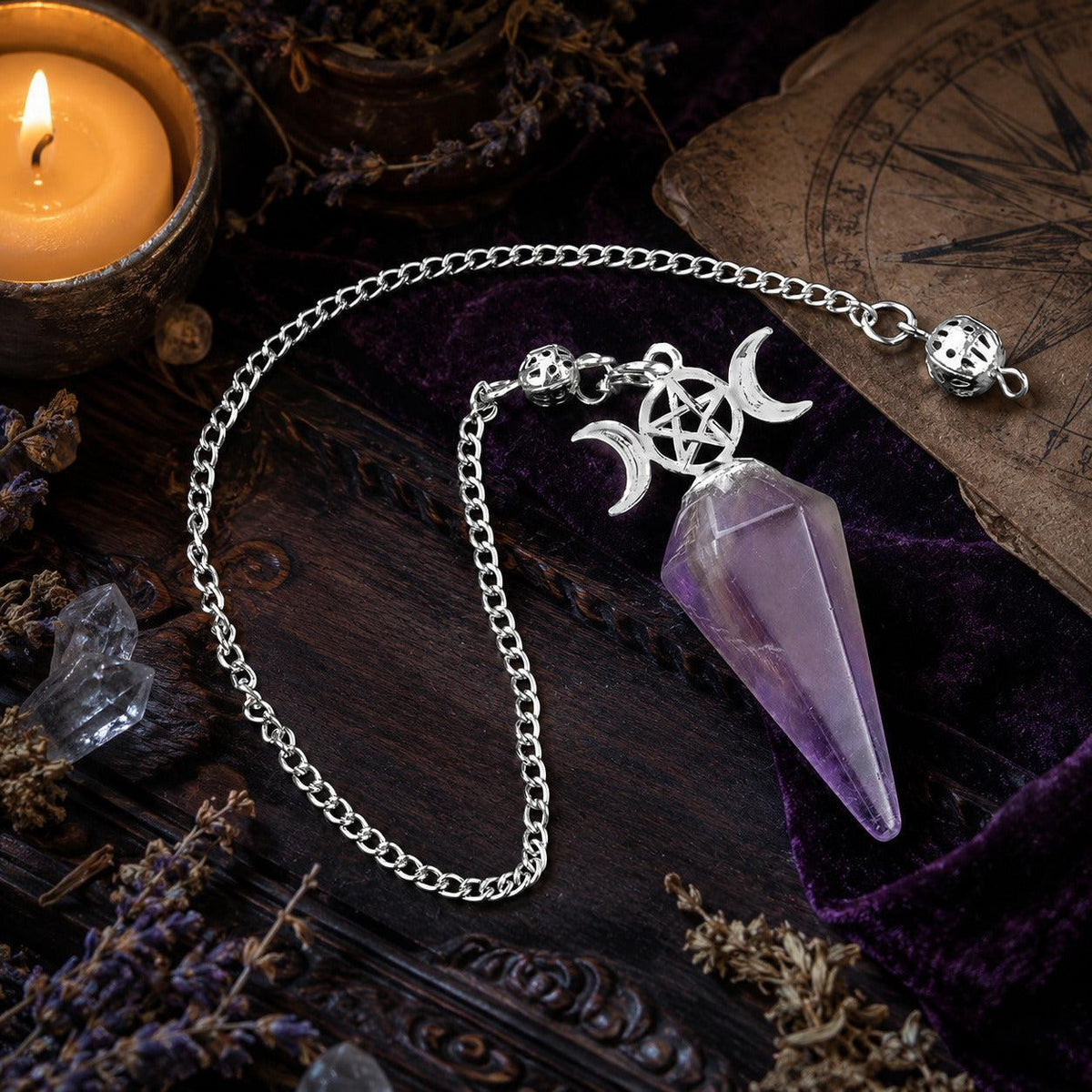 Amethyst Triple Moon crystal pendulum on a Wiccan ritual altar
